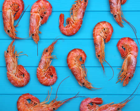 Shrimps background on wood. Top view. の写真素材