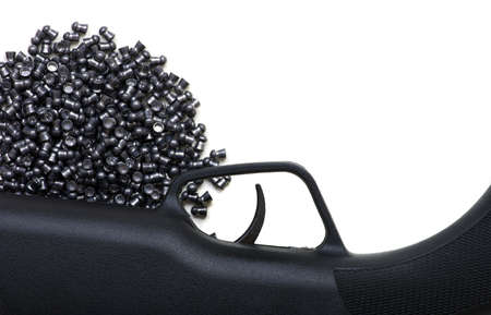 Black air rifle gun on a white background and lead pellets