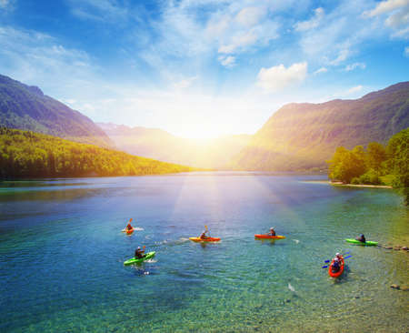 Kayakers on mountain lake with pure waterの写真素材