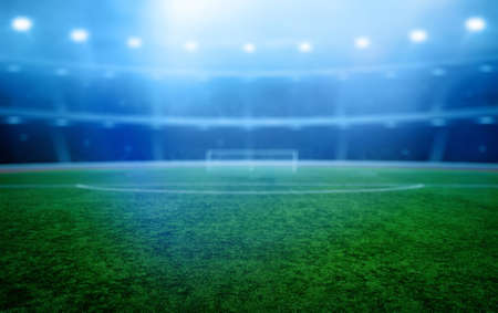 Stadium with the bright lights and green grassの写真素材