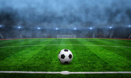 Ball on the green field in soccer stadiumの写真素材