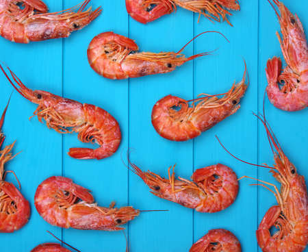 Shrimps background on wood. Top view.の写真素材