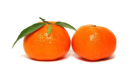 Tangerine with green leaf isolated on white backgroundの写真素材