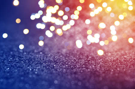 Christmas and New Year background . Glitter lights defocused.の写真素材