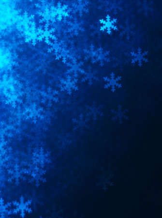 Blue snowflakes abstract lights . Blurred Bokeh. Christmas and winter background.の写真素材