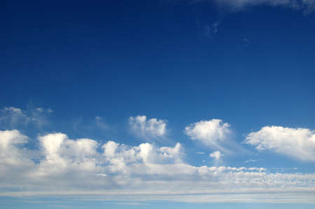 sky background and white cloudsの写真素材