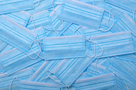 Doctor medical mask on blue background .