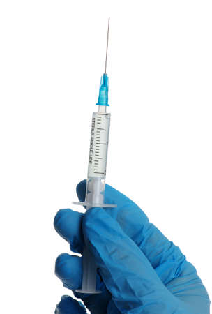 vaccine in glass bottle in  doctor hand isolated on white background.の写真素材