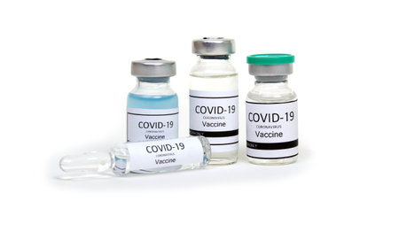 vaccine ampoule isolated on a white background. Clear glass medicine bottle.の写真素材