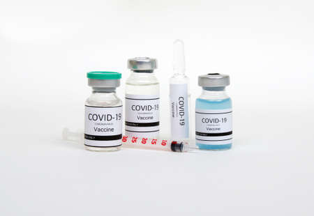 Vaccine bottles, vials medicine and syringe injection  isolated on white. Vaccination, immunization, treatment to infection.の写真素材