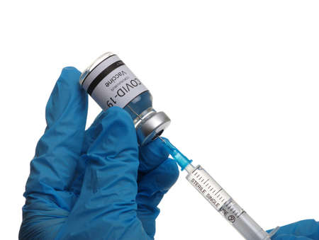 Doctor hand holding a syringe with vaccines isolated on white background. Vaccination, immunization, treatment to infection.の写真素材