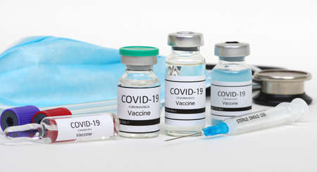 Vaccine bottles, vials medicine and syringe injection  isolated on white. Vaccination, immunization, treatment to infection.の写真素材