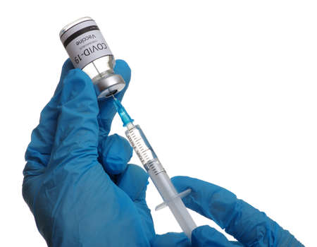 vaccine  in glass bottle in  doctor hand isolated on white background.の写真素材