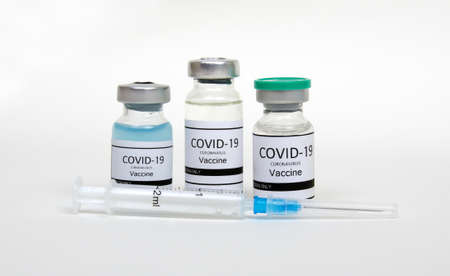Vaccine bottles, vials medicine and syringe injection  isolated on white. Vaccination, immunization, treatment to infection.の写真素材