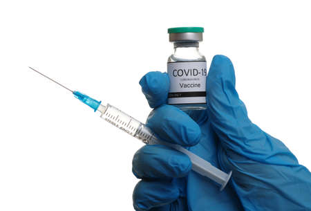 Doctor hand holding a syringe with vaccines isolated on white background. Vaccination, immunization, treatment to infection.の写真素材