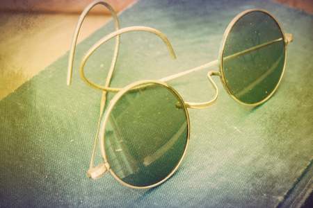 Vintage photo with old John Lennon glassesの写真素材