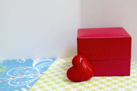 Small red box and a heart with greeting cards