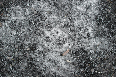 Black background, texture of burnt coals, safety precautions.