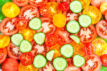 Background from sliced â€‹â€‹tomatoes and cucumbers.