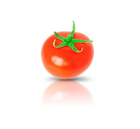Red tomato with green tail isolated on white with shadow and reflection.の写真素材