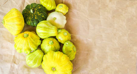 Patison of different size, shape and color on the table.の写真素材