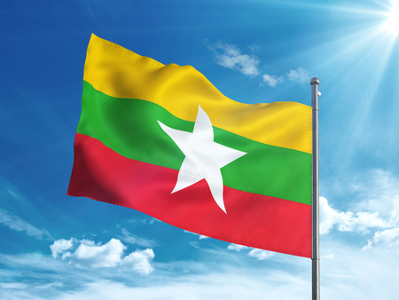 Myanmar flag waving in the blue skyの写真素材