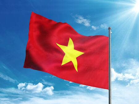 Vietnam flag waving in the blue skyの写真素材