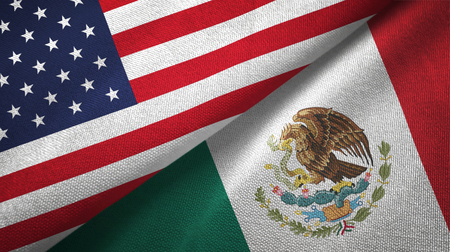 United States and Mexico flags together textile cloth, fabric textureの写真素材