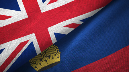 United Kingdom and Liechtenstein flags together relations textile cloth, fabric textureの写真素材
