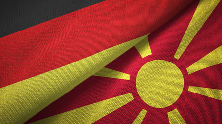 Germany and Macedonia flags together relations textile cloth, fabric textureの写真素材