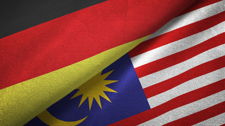 Germany and Malaysia flags together relations textile cloth, fabric textureの写真素材