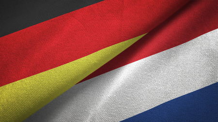 Germany and Netherlands flags together relations textile cloth, fabric textureの写真素材