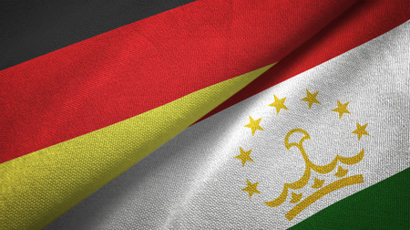 Germany and Tajikistan flags together relations textile cloth, fabric textureの写真素材