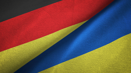 Germany and Ukraine flags together relations textile cloth, fabric textureの写真素材