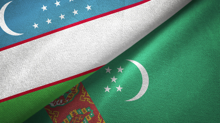 Uzbekistan and Turkmenistan flags together textile cloth, fabric textureの写真素材