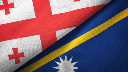 Georgia and Nauru two folded flags togetherの写真素材