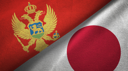 Montenegro and Japan two flags textile cloth, fabric textureの写真素材