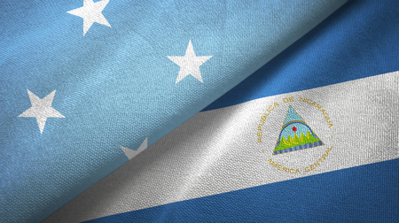 Micronesia and Nicaragua two flags textile cloth, fabric textureの写真素材