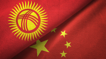 Kyrgyzstan and China flags together textile cloth, fabric textureの写真素材
