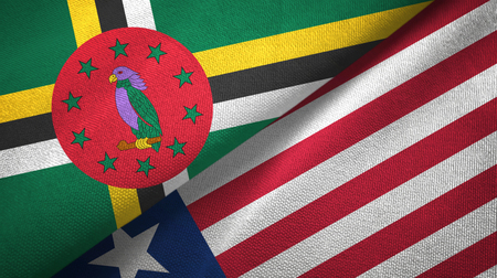 Dominica and Liberia two flags textile cloth, fabric textureの写真素材