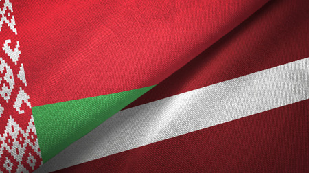 Belarus and Latvia flags together textile cloth, fabric textureの写真素材
