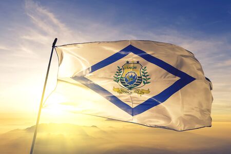 Maracanau of Brazil flag textile cloth fabric waving on the top sunrise mist fogの写真素材