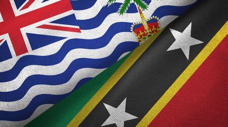 British Indian Territory and Saint Kitts and Nevis two folded flags togetherの写真素材
