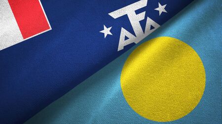 French Southern and Antarctic Lands and Palau two folded flags togetherの写真素材