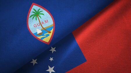 Guam and Samoa two folded flags togetherの写真素材