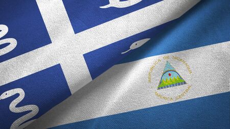 Martinique snake and Nicaragua two folded flags togetherの写真素材
