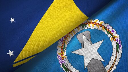 Tokelau and Northern Mariana Islands two folded flags togetherの写真素材
