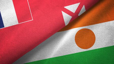 Wallis and Futuna and Niger two folded flags togetherの写真素材