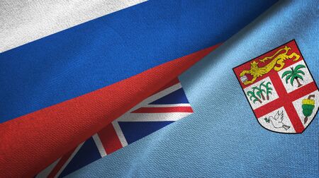 Russia and Fiji two folded flags togetherの写真素材