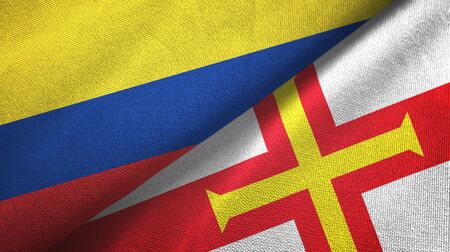 Colombia and Guernsey two folded flags togetherの写真素材